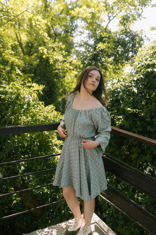 Daisy Dress – front view – off-shoulder elastic neckline, long sleeves, drawstring waist, flared skirt – Cori Tailor