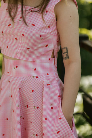 Close-up of Lolita Set showing cherry pink gingham crop top side cut detail and high-waisted skirt — Cori Tailor summer set.