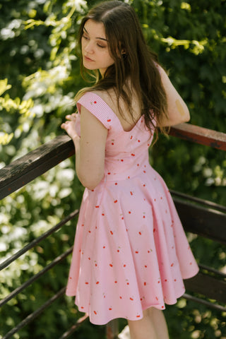 Back view of the Lolita Top by Cori Tailor, pink gingham cotton with cherry print, deep V-back design — vintage-inspired summer top.