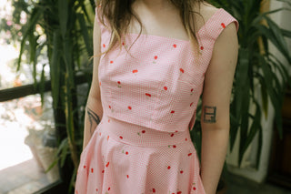 Close-up front detail of the Lolita Top by Cori Tailor, pink gingham cotton with cherry print, structured crop top with square neckline — perfect for summer outfits.
